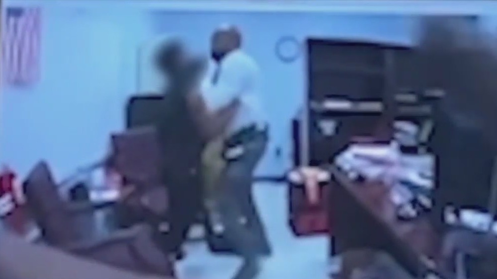 Coach says he was forced to grab student who brought gun to school