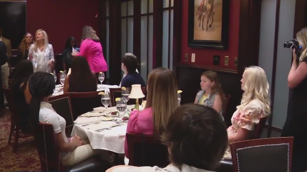 Local kids learning dinner etiquette