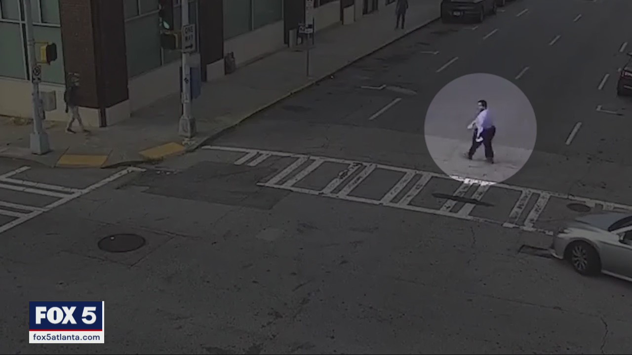 Police arrest man seen assaulting victim on sidewalk
