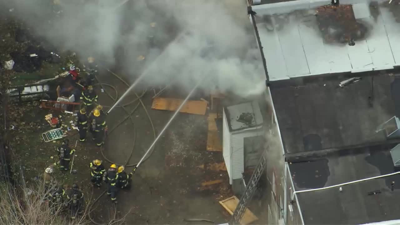 Fire crews work to extinguish flames in several Frankford rowhomes