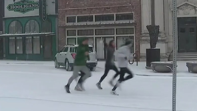 North Texas residents having fun in the light snow
