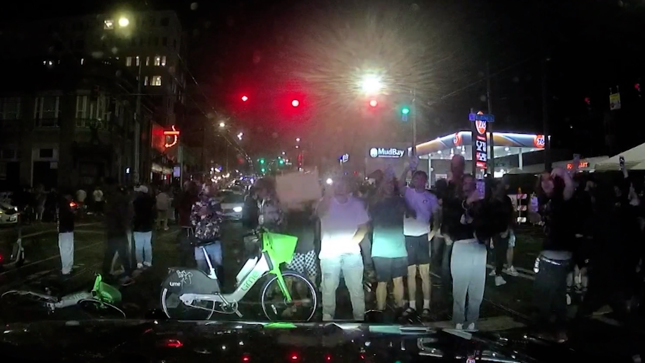 Police dashcam video captures unruly crowd at Capitol Hill illegal street racing event