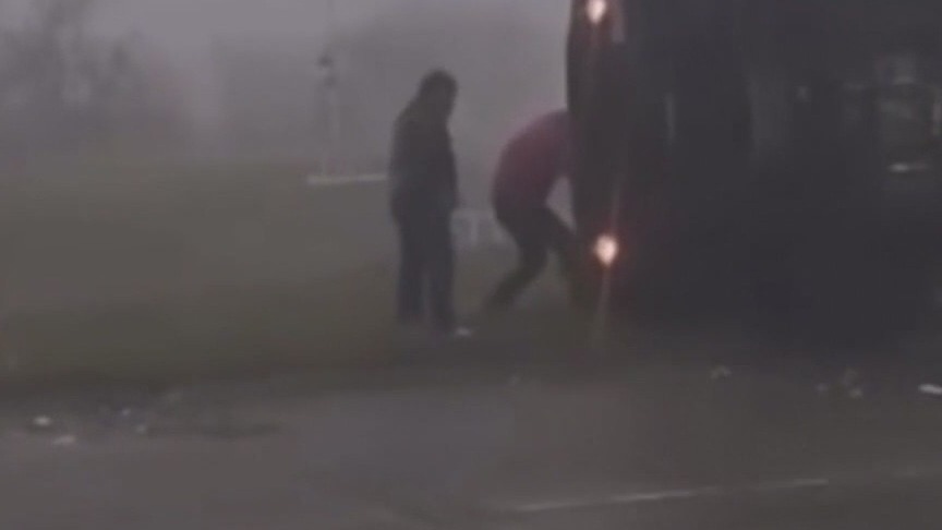 Man helps rescue UPS driver in overturned truck during severe weather