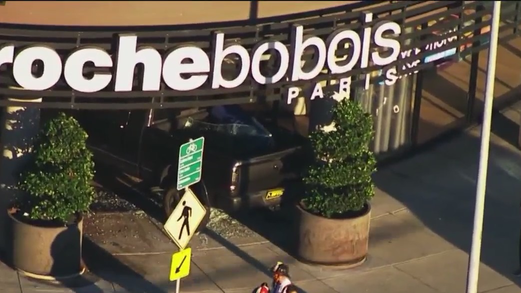 Car slams into SF furniture store