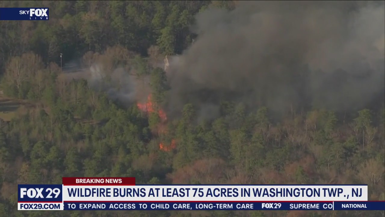 Over two dozen structures threatened by uncontained wildfire in Washington Township