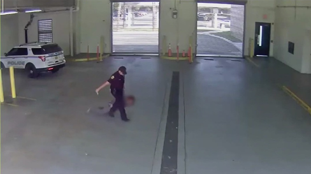 Florida officer fired, accused of dragging woman from car