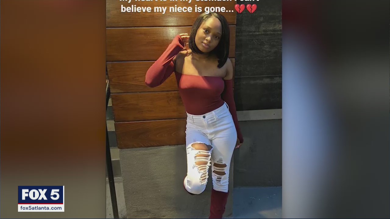 Woman gunned down while hold her baby, family say