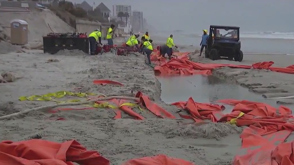 Strong surf damages temporary seawalls in Volusia County