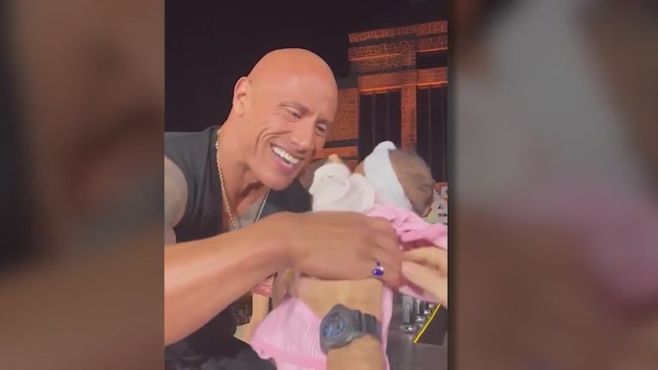 Video: Baby crowd-surfs into the giant arms of Dwayne ‘The Rock’ Johnson