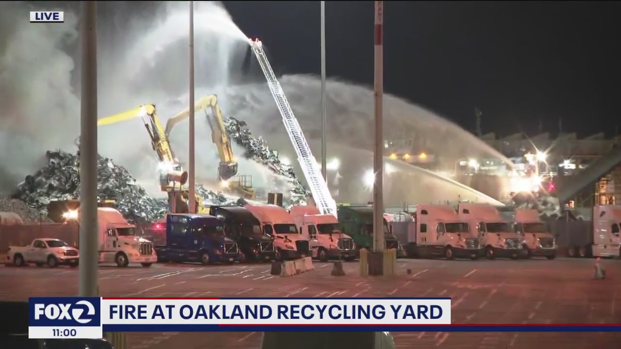 Stubborn fire in Oakland at recycling yard started from large debris pile