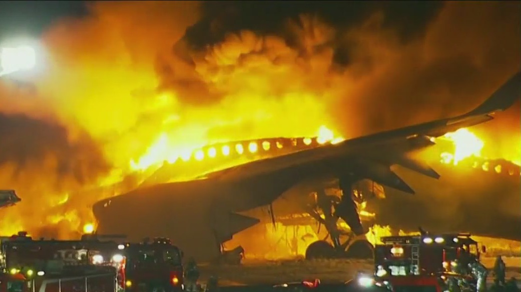 Japan Airlines plane on fire at Tokyo airport