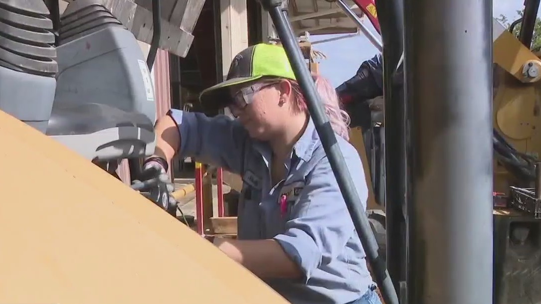 Woman inspires others by working trade job