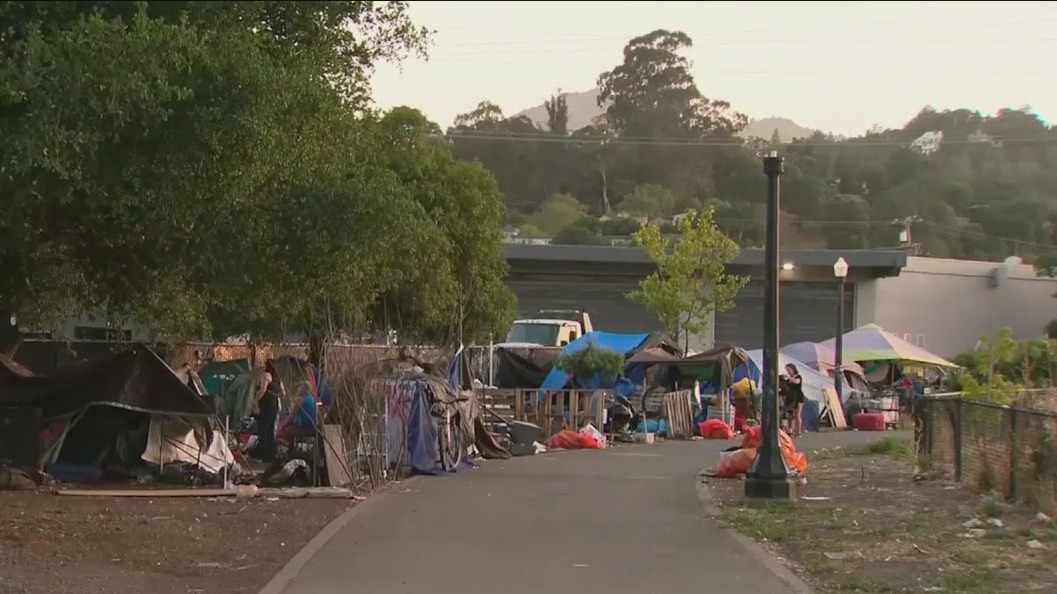 Homeless sue over shop's loud music