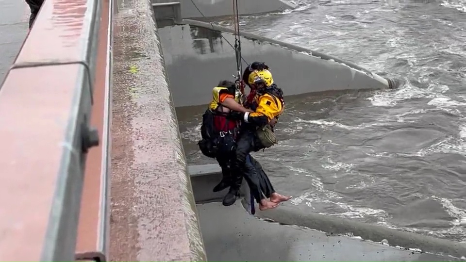 Firefighters rescue man swept away in Santa Ana River