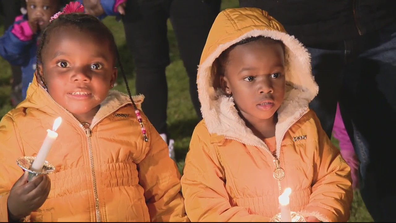 Relatives of murdered mother of 3 small children hold vigil to remember her