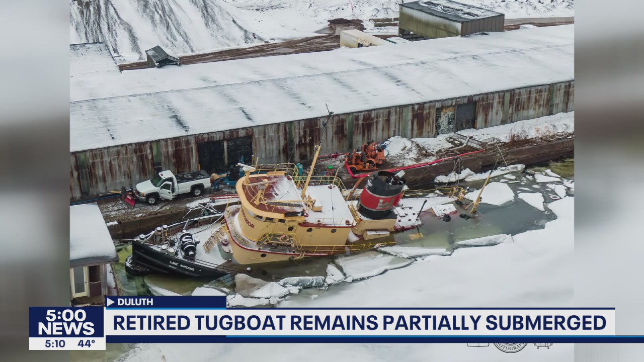 Retired tugboat remains partially submerged in Duluth, Minn.
