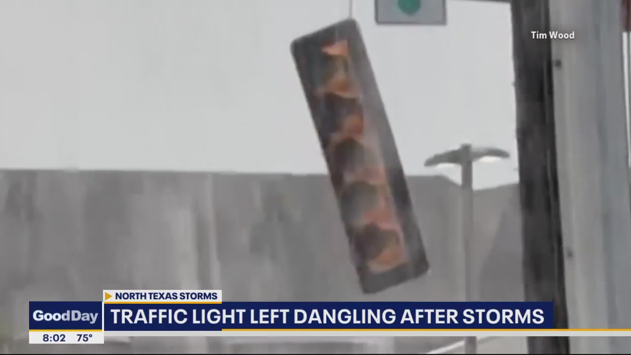 Lewisville traffic light left dangling after storms
