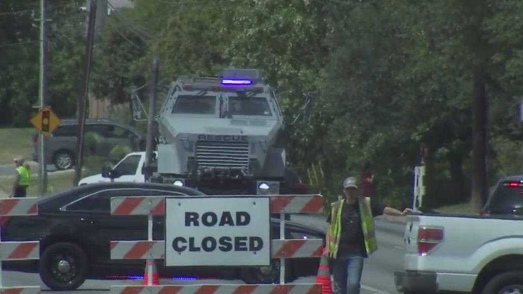 Police respond to possible barricaded subject with rigged explosives