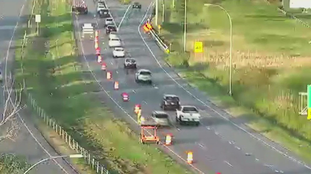 Construction worker hit by traffic barrel