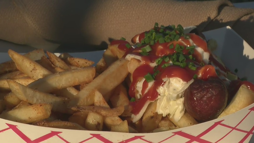 Paul Milliken gets a taste of The Village Dunwoody's "dawgs"