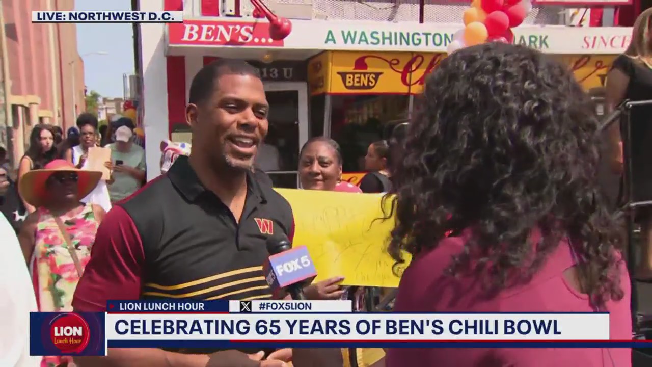 Commanders President Jason Wright helps celebrate Ben's Chili Bowl