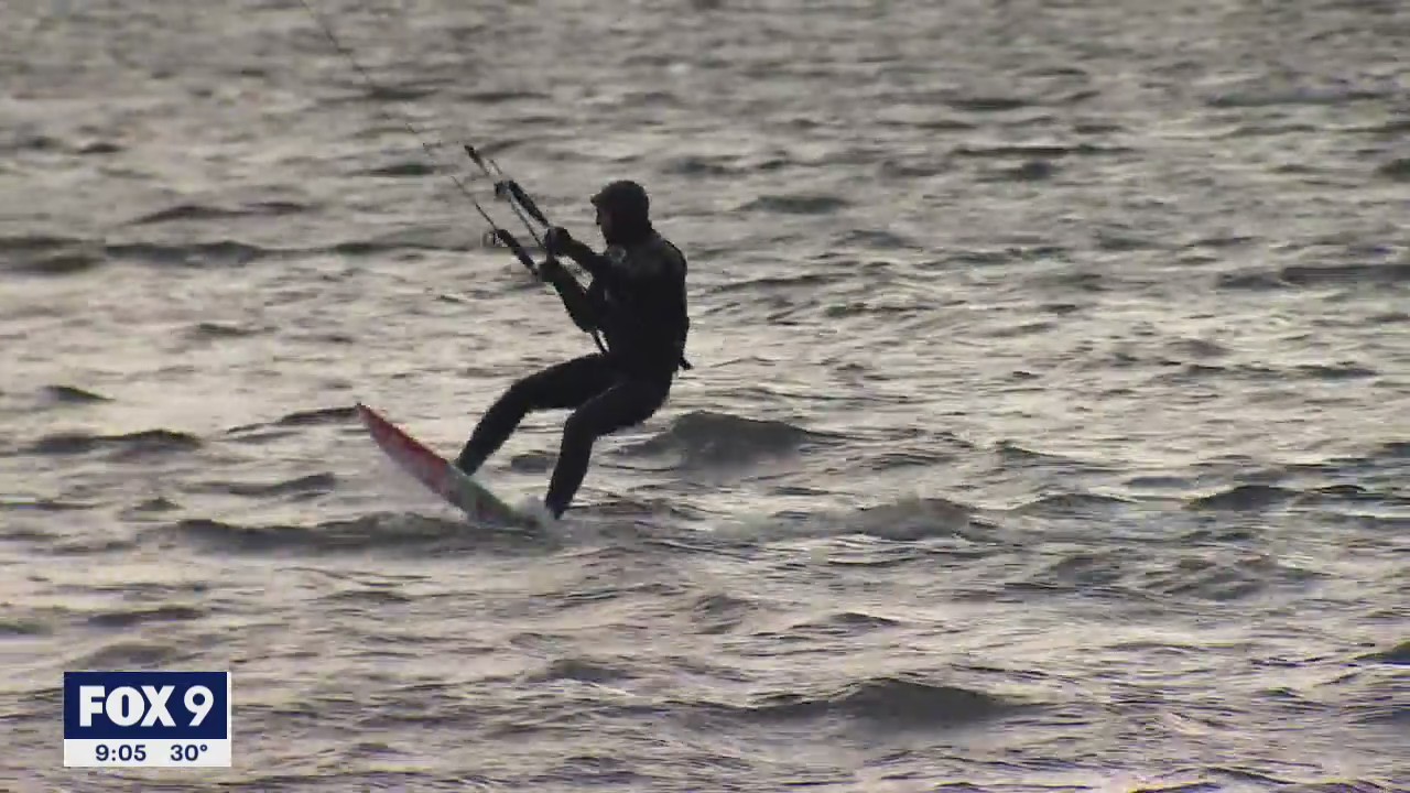 Kitesurfer braves snowy Minnesota cold to catch some wind