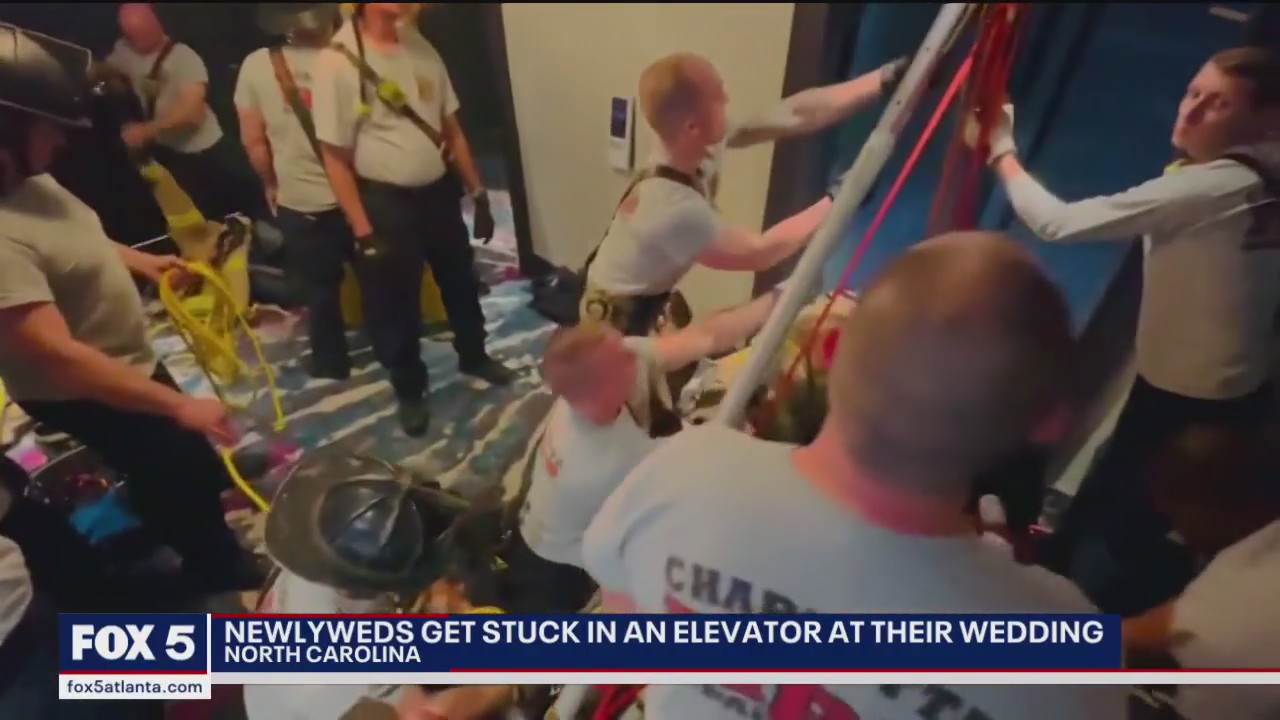 Newlyweds get stuck in elevator at their wedding