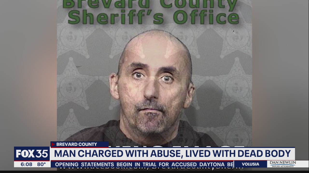 Man charged with abuse, lived with dead body