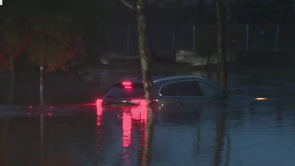 Car partially submerged in Petaluma parking lot
