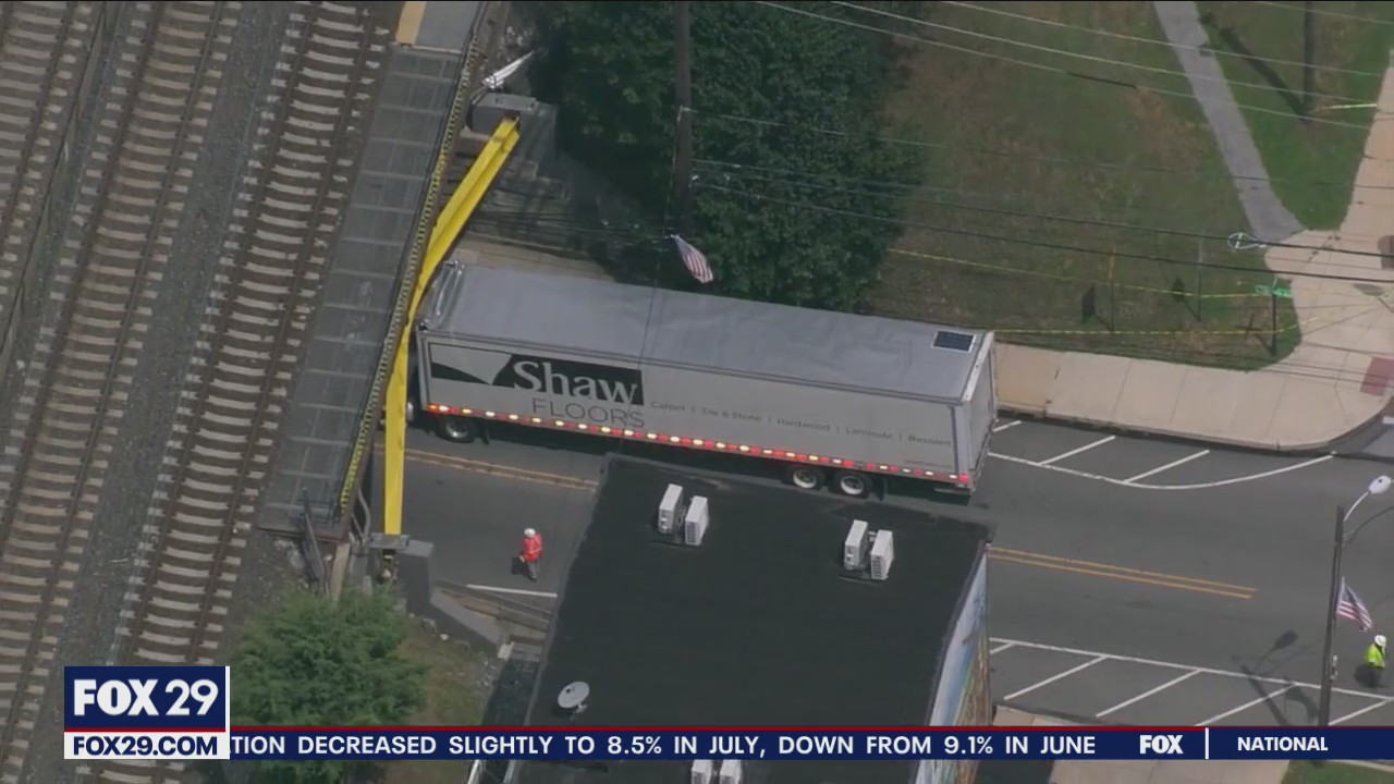 Tractor trailer strikes, gets stuck under a Delaware County Amtrak