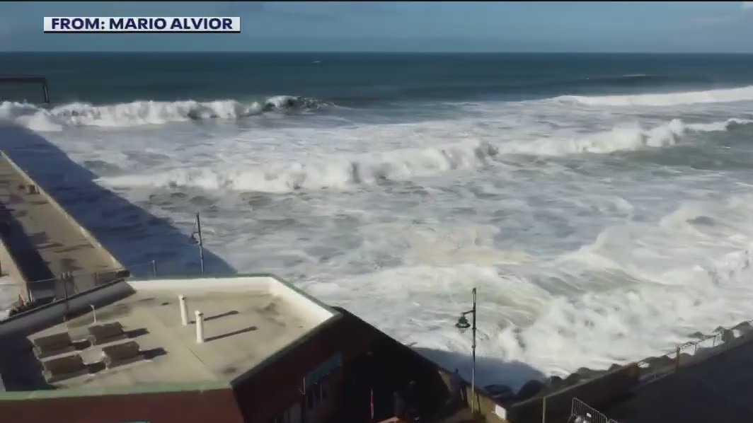 Waves crash on Pacifica coast, high surf warning downgraded