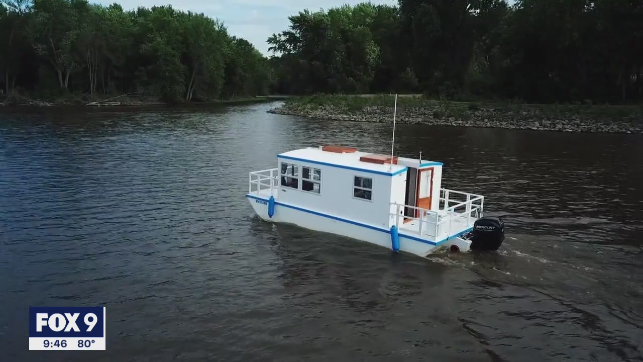 After 14 years Minnesota man sets sail in homemade houseboat