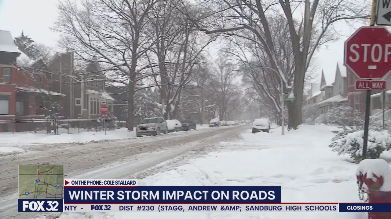 Chicago snow plows spend all night paving main roads, side streets