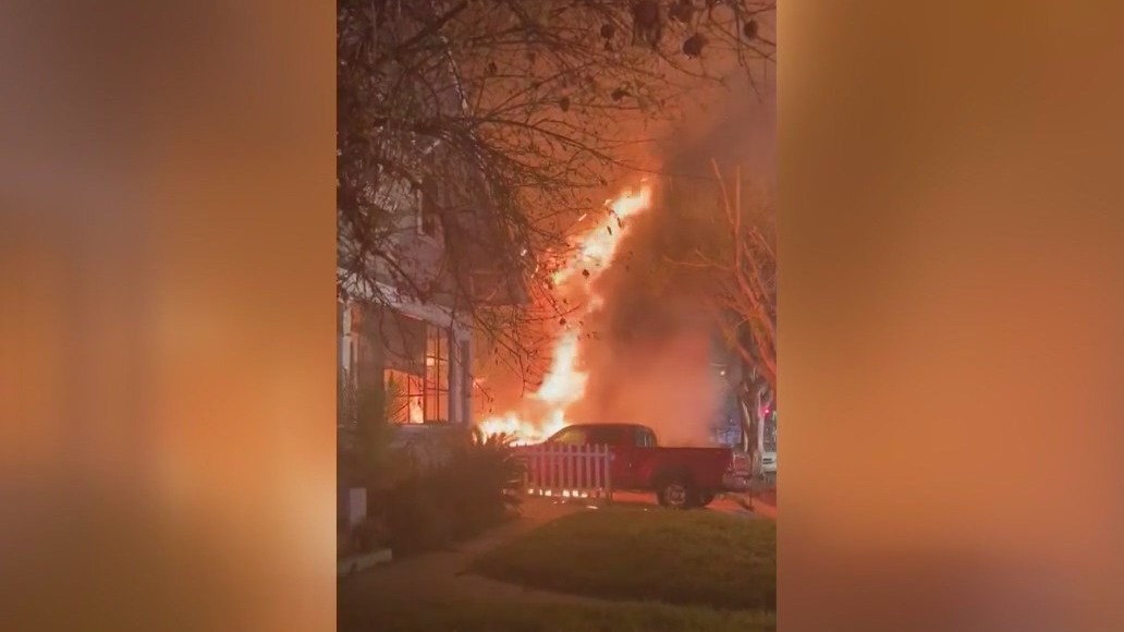 Cellphone video shows flames shooting through home