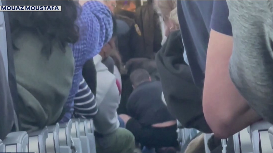 American Airlines flight diverted due to unruly passenger who reportedly tried to open plane door, enter cockpit