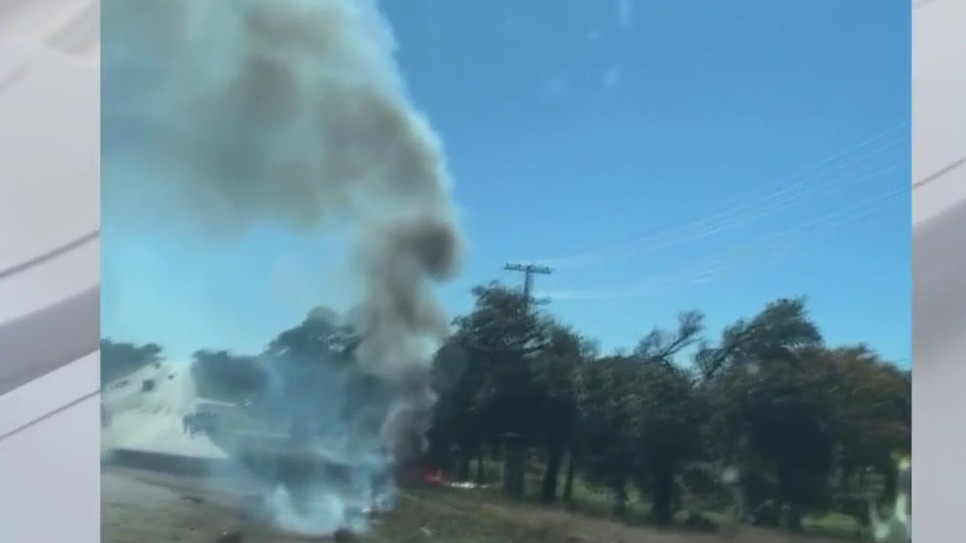 Plane strikes power line, crashes into car