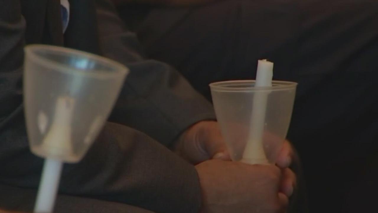 Community members gather for vigil honoring Uvalde and Buffalo victims