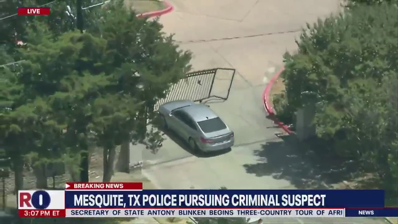 Wild police chase: GTA driver plows through gate, tries to hide behind AC