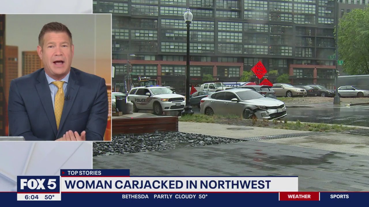 Woman carjacked at gunpoint while putting baby in car