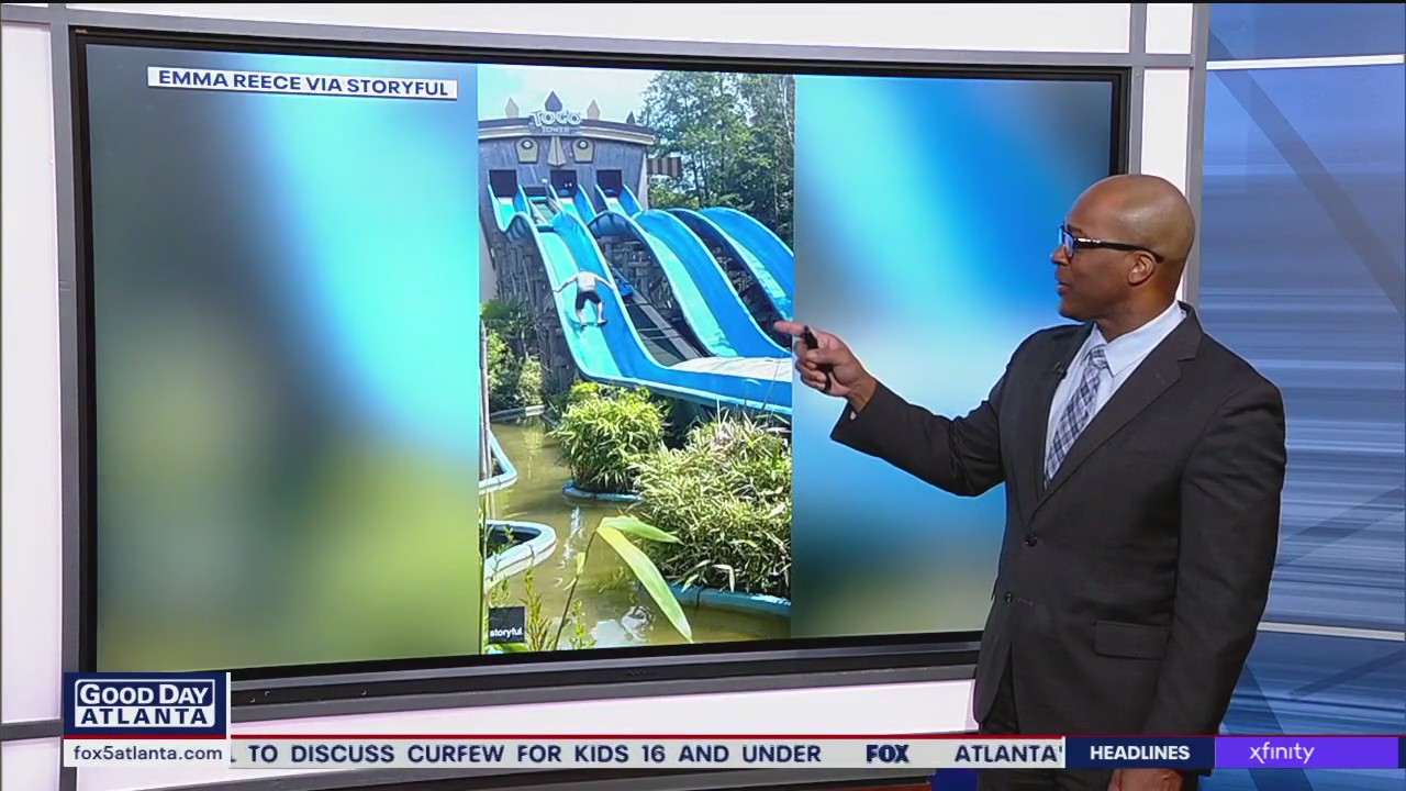 Dad scales waterslide to help daughter