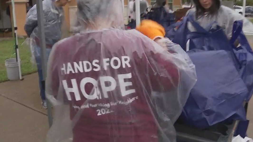 Hands for Hope volunteers distribute meal kits to families in need
