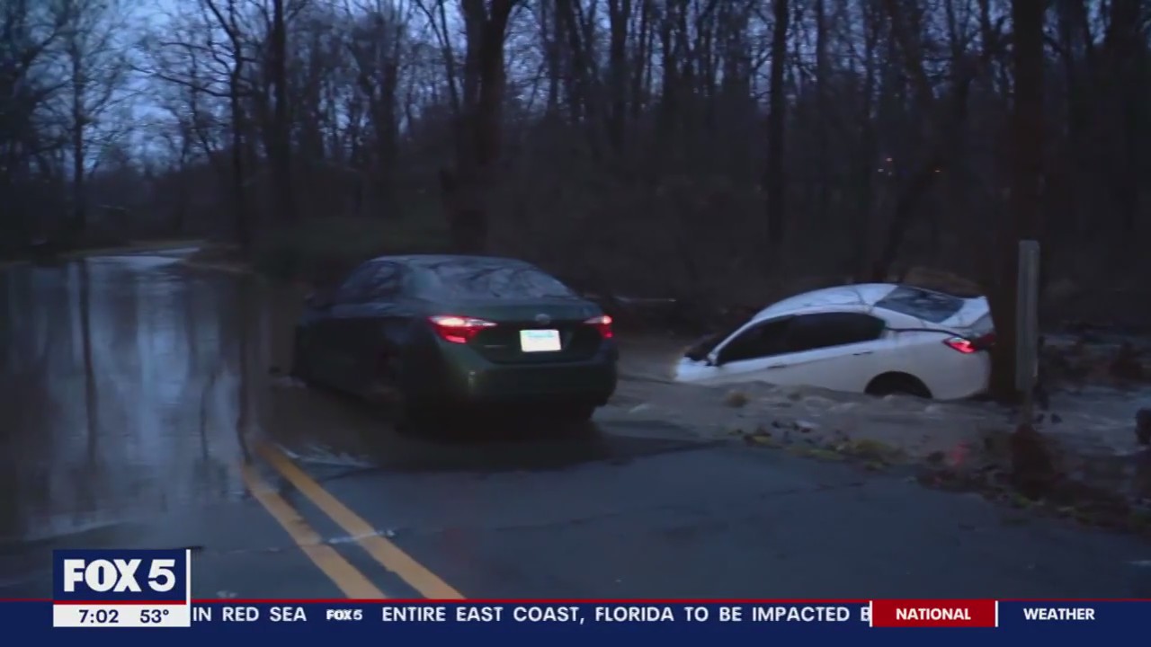 Driver clinging to tree rescued after swept away when rain floods roadway in Montgomery County