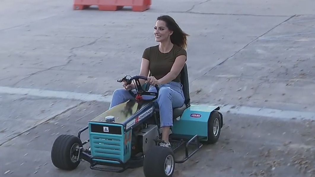 Jen and Dave race in lawnmowers