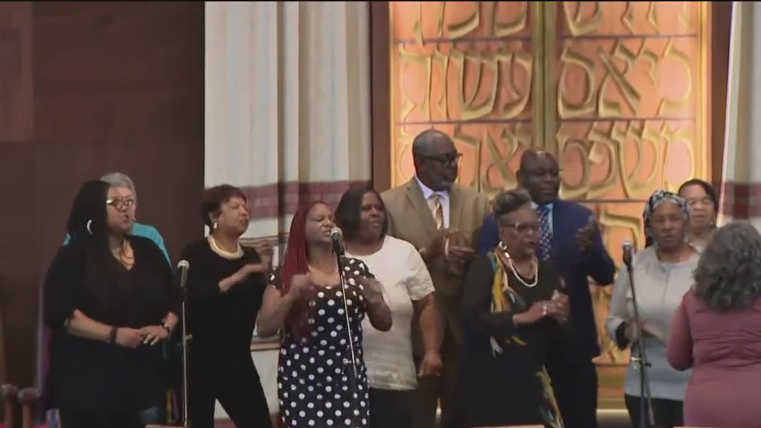 Oakland church members pray at synagogue after fire