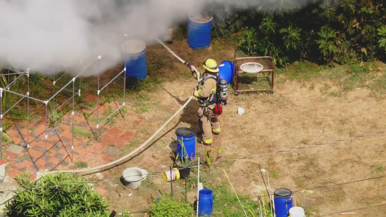 Firefighters hose backyard La Puente fire