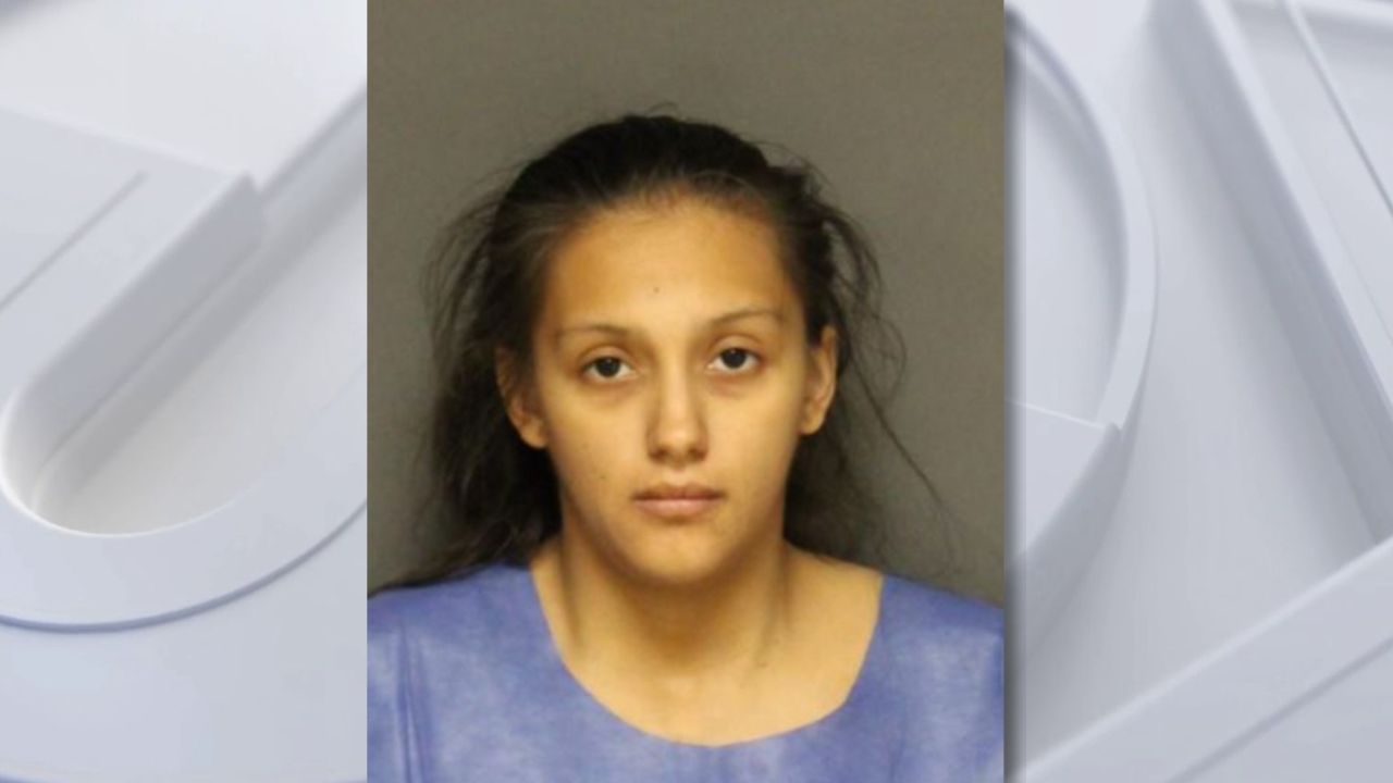 Woman charged with abandoning newborn baby in trash