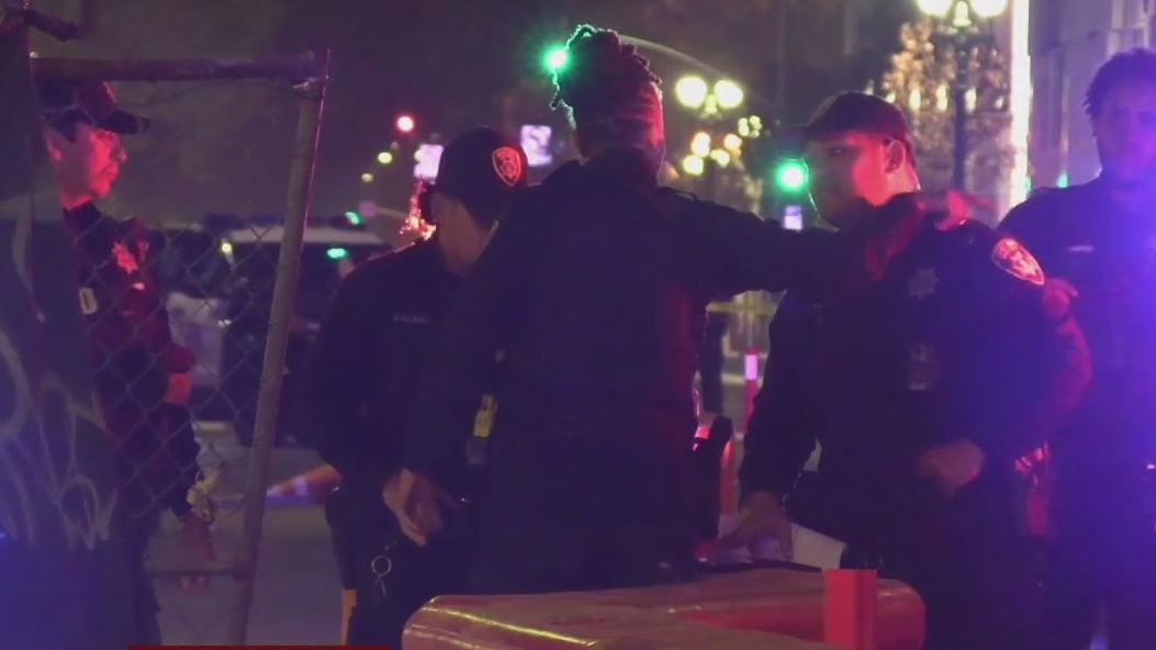 Car with bullet holes crashes into site near Oakland federal building