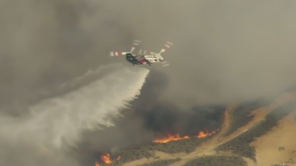 Fire erupts along Southern California highway