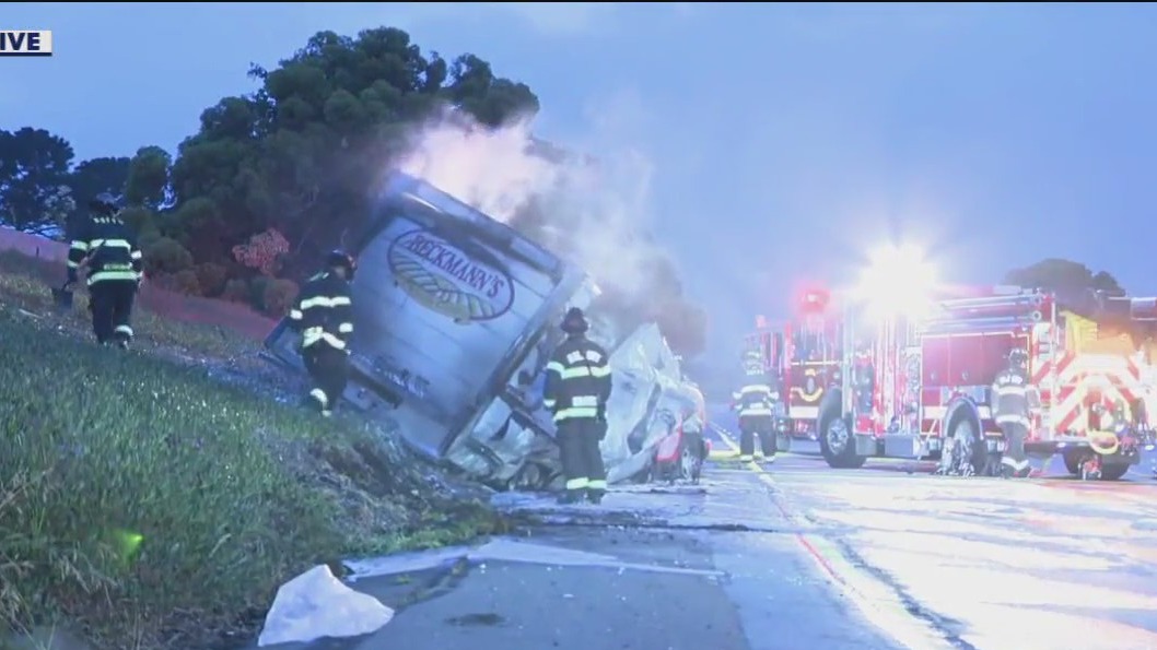 Truck flips over, catches on fire in South SF