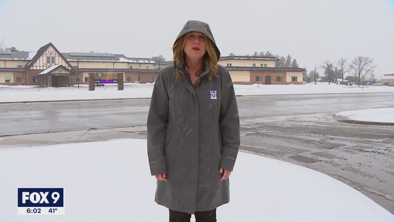 FOX 9's Karen Scullin suffers through the bad weather
